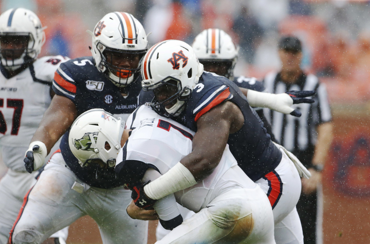 Nov 23, 2019; Auburn, AL, USA; Auburn Tigers defensive end Marlon Davidson (3) tackles Samford Bulldogs quarterback Liam Welch (7) during the second quarter at Jordan-Hare Stadium.
